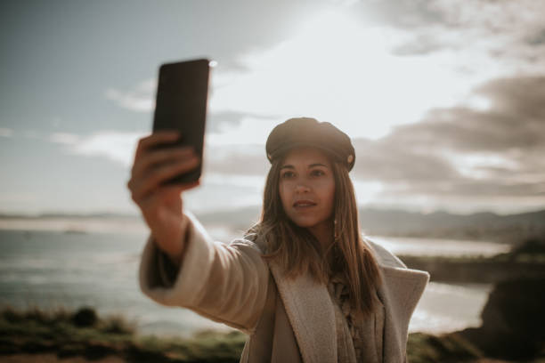 istock Young woman taking her selfie picture 1127155654