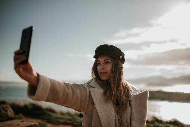 istock Young woman taking her selfie picture 1127155661
