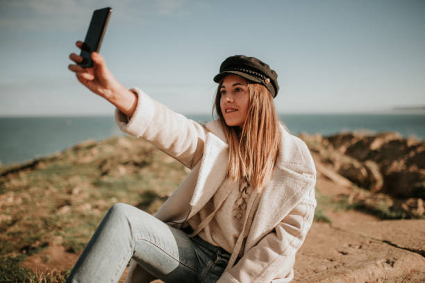 istock Young woman taking her selfie picture 1127155668