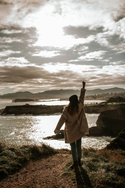 istock Young woman with high fist 1127155713