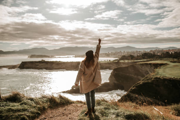 istock Young woman with high fist 1127155785