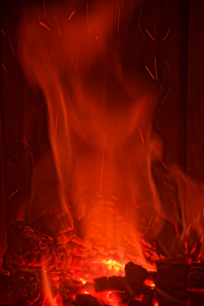 istock Red flames from burning wood in a fireplace at home 1127155827