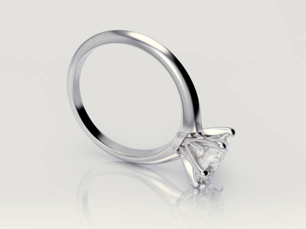 istock Close-up solitaire diamond engagement ring on white background 1127157248