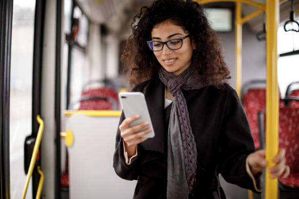 istock Young woman traveling by  bus and using smart phone 1127157553