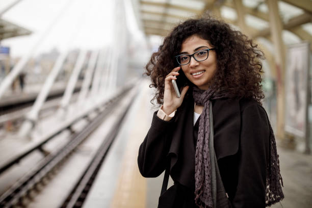 istock Young woman using her smart phone on the station 1127157577