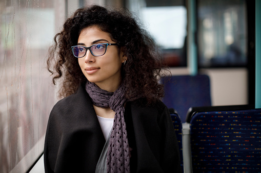 Young woman commuting by public transport