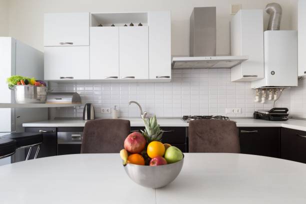 istock Interior. Kitchen modern, white, brown, beige color, fruits and vegetables 1127157784