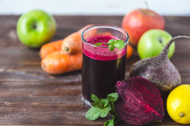 fresh juice from homemade vegetables. Beet smoothie. Detox, vegetarianism On a bright wooden background stock photo