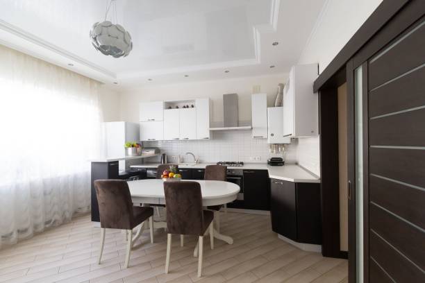 istock Interior. Kitchen modern, white, brown, beige color, doors 1127157982