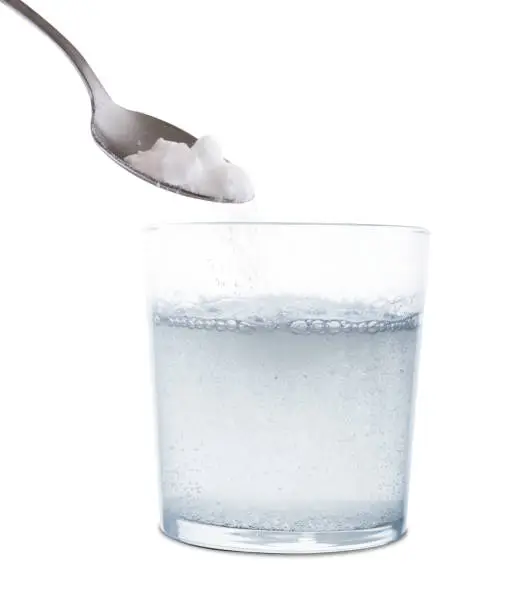 Photo of Pour effervescent powder medicine into a glass of water