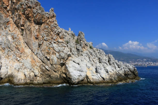 istock Rocky sea coast with the wave. 1127159110