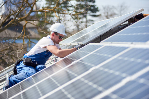 installing solar photovoltaic panel system on roof of house - solar power station solar panel energy electrician imagens e fotografias de stock