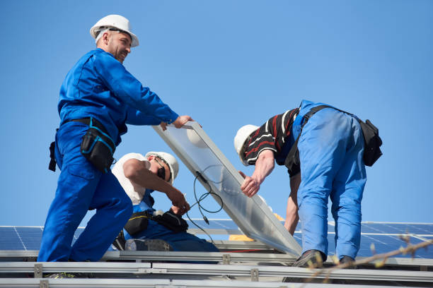 istock Installing solar photovoltaic panel system on roof of house 1127159203