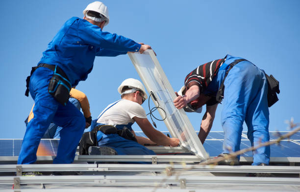 istock Installing solar photovoltaic panel system on roof of house 1127159208