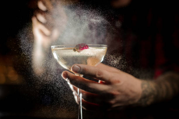 istock Tattooed bartender splashing bitter on the elegant cocktail glass 1127159341