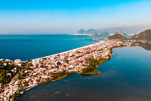 Piratininga distric and Itaipu lake at Niteroi / RJ. Rio de Janeiro on the background.