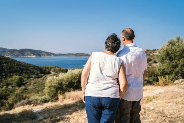 istock Senior couple at seaside viewpoint 1127162354