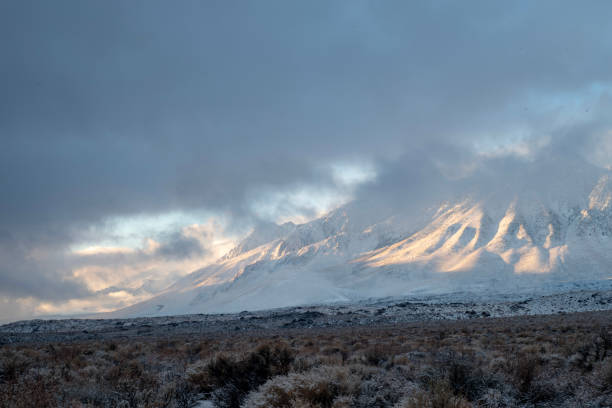 istock morning clouds around snowy mountain peaks Sierra Nevada landscape 1127163304