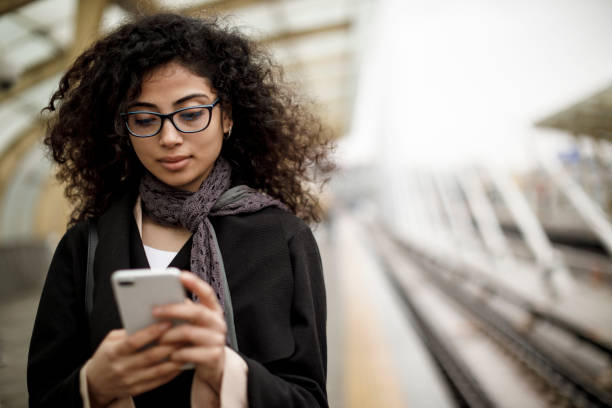 istock Young woman texting on the phone 1127163383