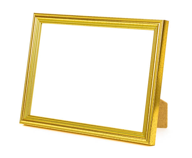 istock Standing golden picture frame on white background 1127165969