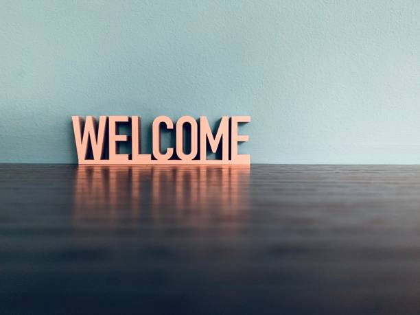 word welcome on blue background - welcome sign imagens e fotografias de stock