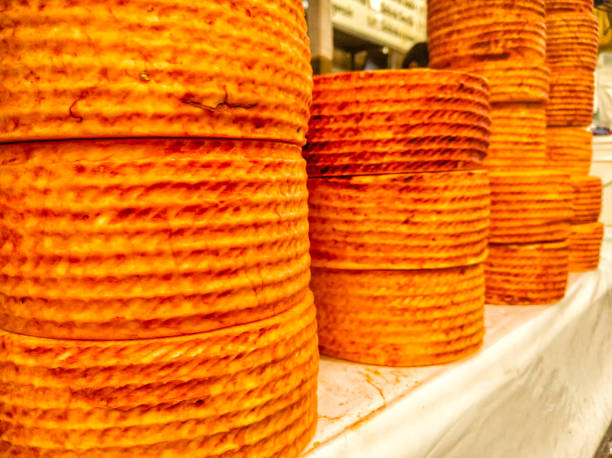 Stacks of cheese wheels truckles of Queso de Cincho Cincho Cheese in market. Iguala, Guerrero. stock photo