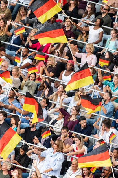 istock Germany supporters waving their flags on a stadium 1127170392