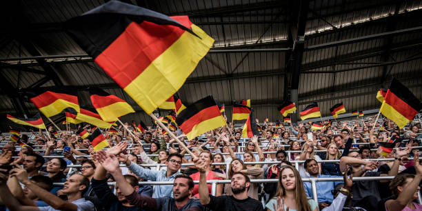 istock Germany supporters waving their flags on a stadium 1127170397