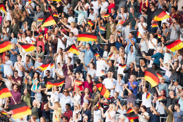 istock Germany supporters waving their flags on a stadium 1127170398