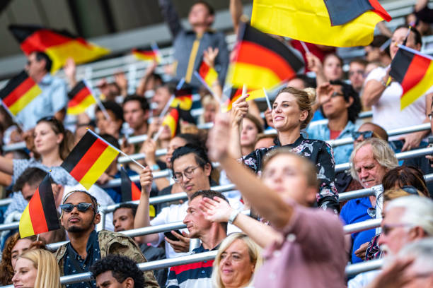 istock Germany supporters waving their flags on a stadium 1127170403