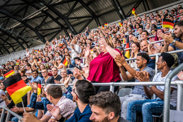 istock Germany supporters waving their flags on a stadium 1127170407