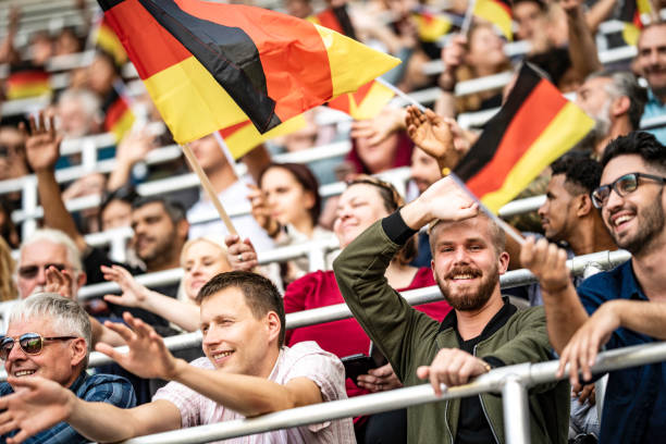 istock Germany supporters waving their flags on a stadium 1127170416