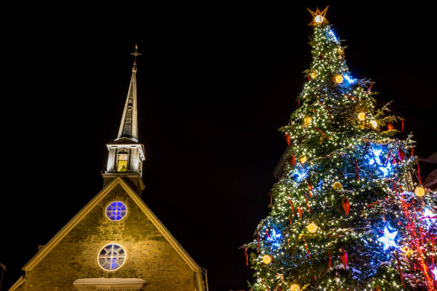 Historic district of Old Quebec city and its buildings during a cold winter night.