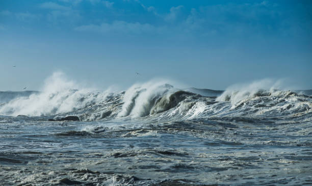 istock Ocean blue wave in ocean. Breaking wave for surfing in Portugal. 1127171218