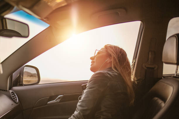 istock Caucasian blond woman enjoying in the car 1127172006
