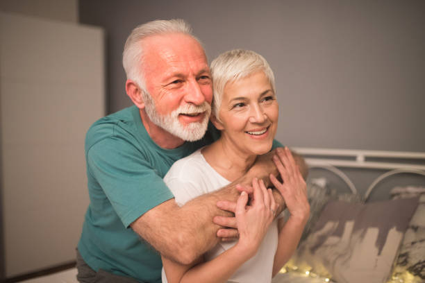 istock Husband and wife hugging 1127172519