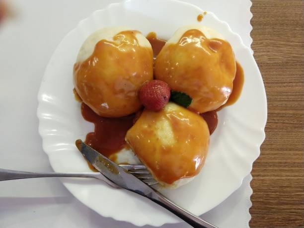 istock Sweet dumplings with strawberries. 1127175284