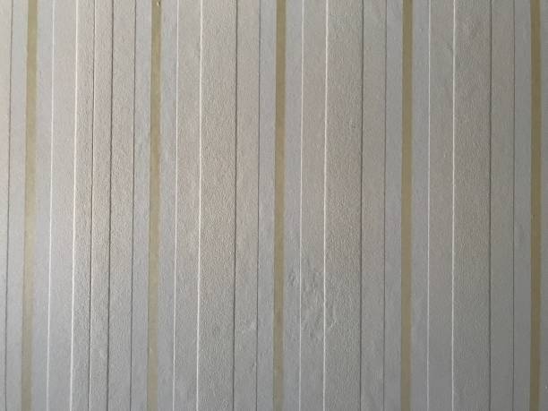 istock Vanilla and mustard stripes wall paper decor texture or background 1127176174