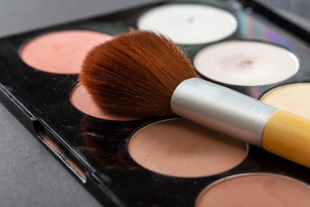 istock Face powder palette and an applicator brush 1127177790