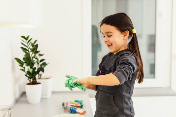 istock Little girl breaking preparing a dough 1127181170