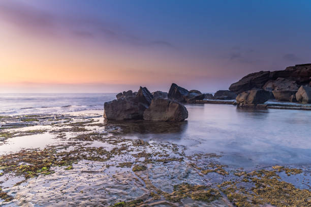 istock Rocky Sunrise Seascape 1127181395