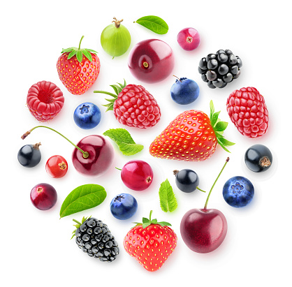 Isolated fresh berries in a circular composition. A group of strawberry, cherry, blackberry and other fresh berries isolated on white background with clipping path