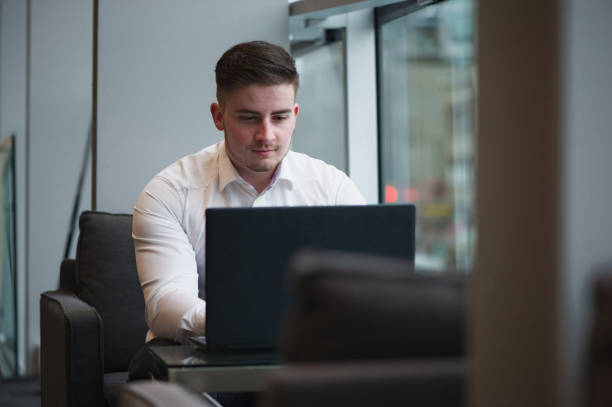 istock handsome man business world laptop 1127183143