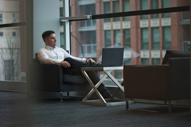 istock handsome man business world laptop 1127183360