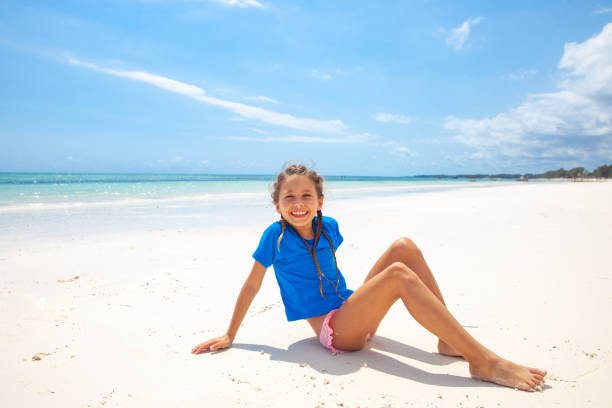 Happy Little Girl on Tropical Beach