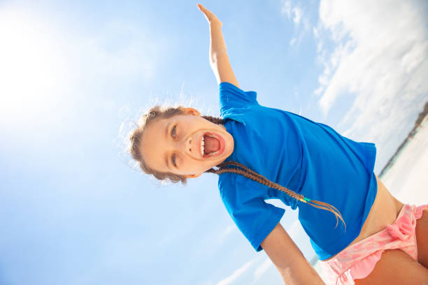 istock Excited Little Girl on Bach Vacation 1127187351