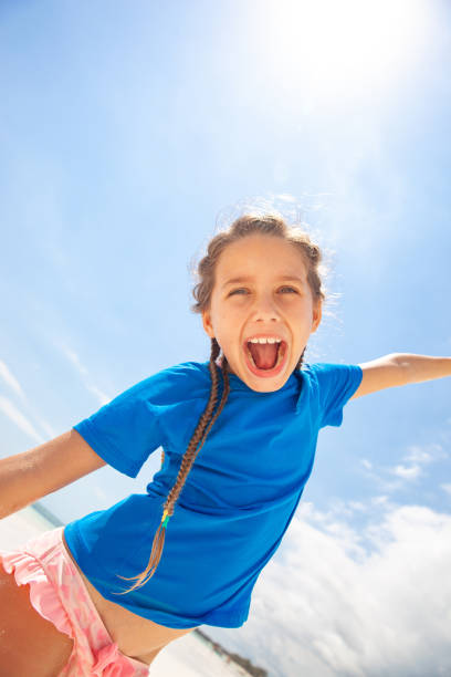 istock Excited Little Girl on Bach Vacation 1127187359