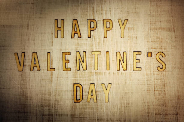 istock Valentine's Day letters on wooden background 1127190615