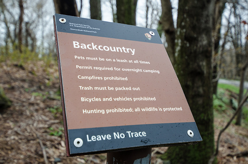 Shenandoah, Virginia - April 1, 2018: Sign from the National Park Service inside Shenandoah National Park explains the rules of the backcountry