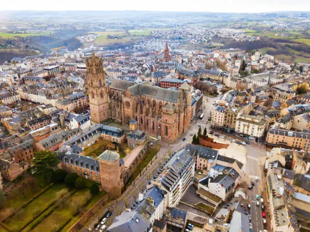 Aerial view of residential houses and ancient historical buildings of French city of Rodez in winter day